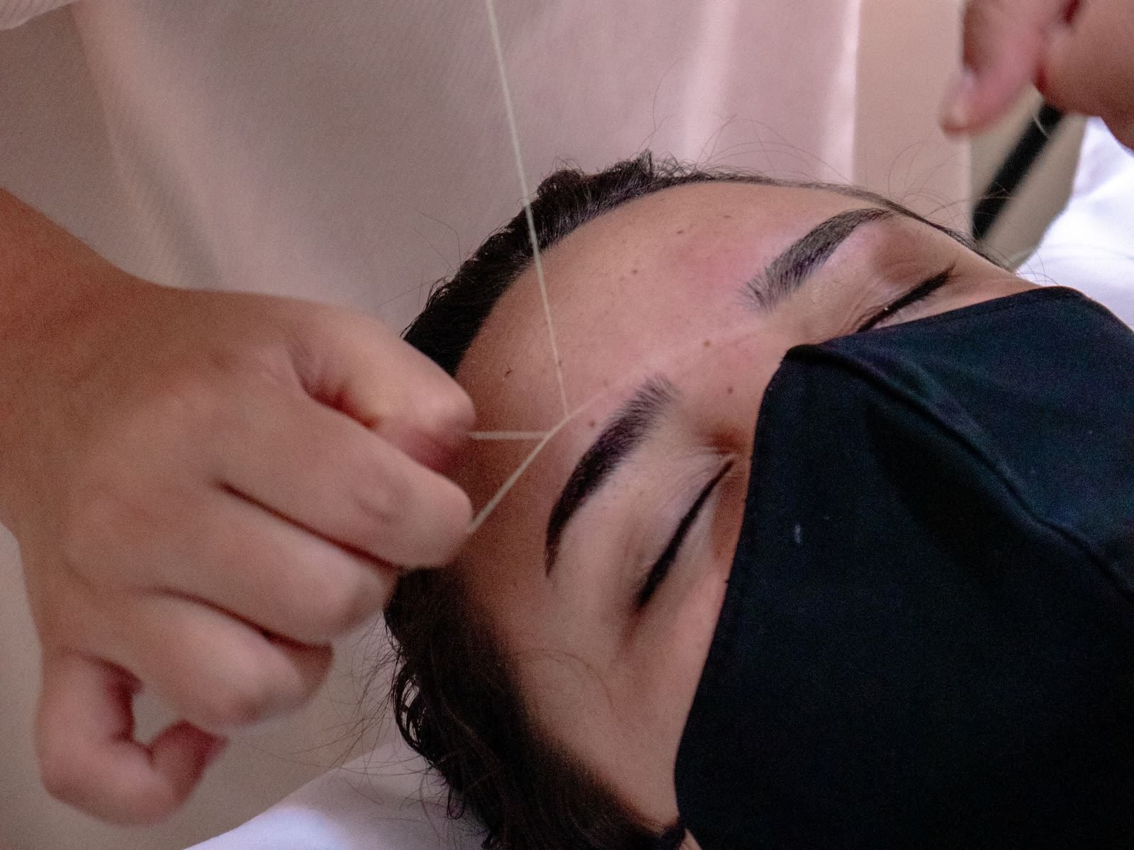 Eyebrow threading being carried out at Lavish Looks in Northampton